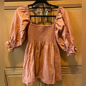 Kourt Portia Smocked Mini Dress with Puff Sleeves in Rust. Size: XS